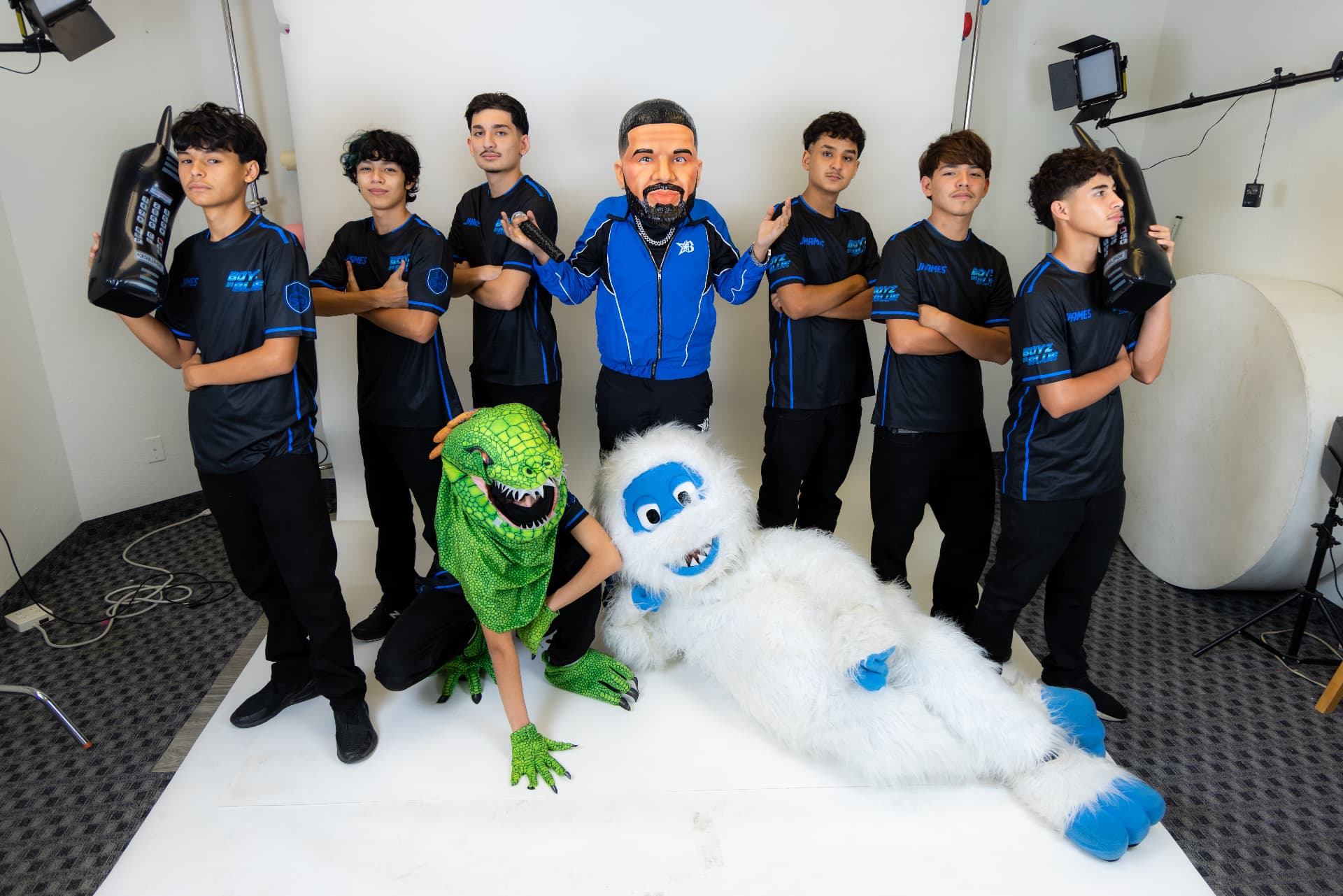 BOYZ IN BLUE dance crew in the studio with Drake, Yeti and Iguana mascots